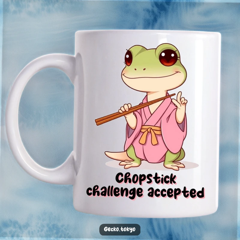 Funny gecko mug, hilariously attempting to balance chopsticks in a pink kimono, embodying playful struggle and determined humor, a delightful funny gift.
