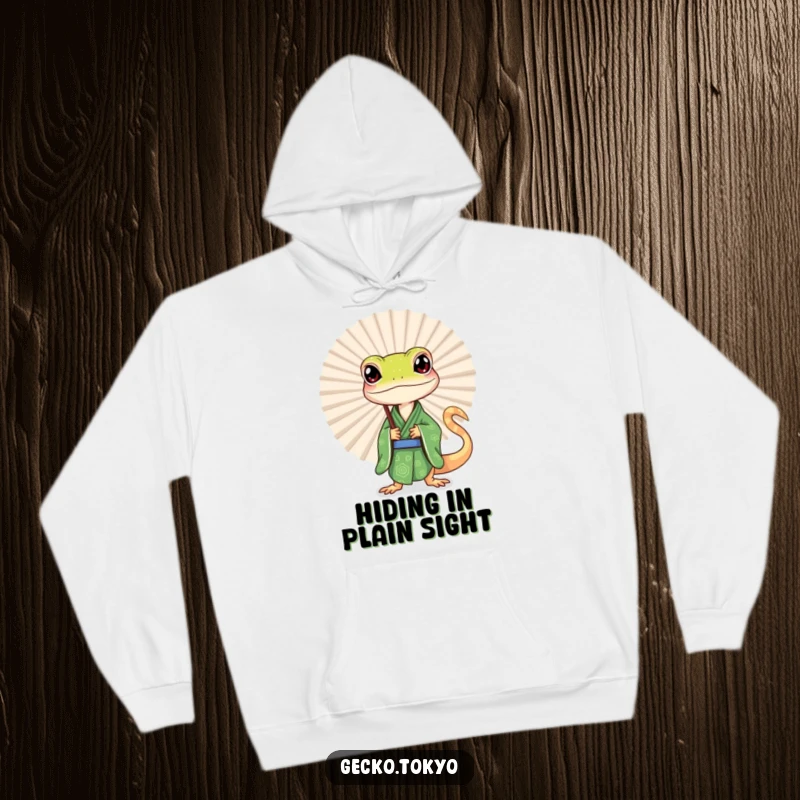 Funny gecko hoodie, peeking inquisitively from behind a large fan in a green kimono, radiating subtle humor and intrigue, a warm funny gift.