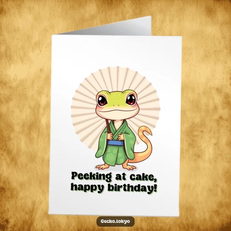 Funny Free Printable Birthday Card with a curious gecko in a green kimono peeking mischievously from behind a large decorative fan.