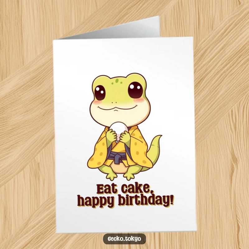 Funny Free Printable Birthday Card with a happy gecko in a yellow kimono joyfully munching on a small rice ball, pure delight.