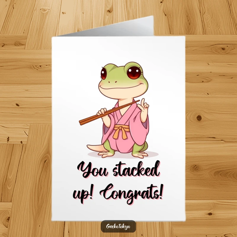 Funny Free Printable Congratulations Card showing a gecko in a pink kimono precariously balancing chopsticks, celebrating their perseverance.